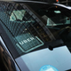 A car with an Uber driver sticker on it.